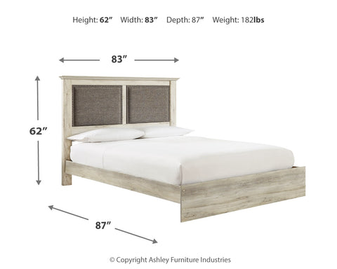 Cambeck King Upholstered Panel Bed with Mirrored Dresser and Chest