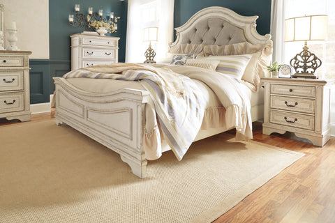 Realyn King Upholstered Panel Bed